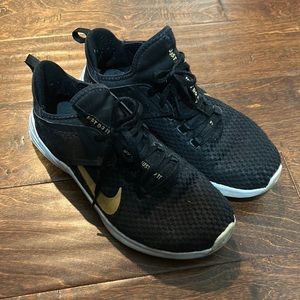 Black and gold Nike cross-trainers